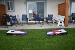 Back patio and lawn and Corn hole game for family fun